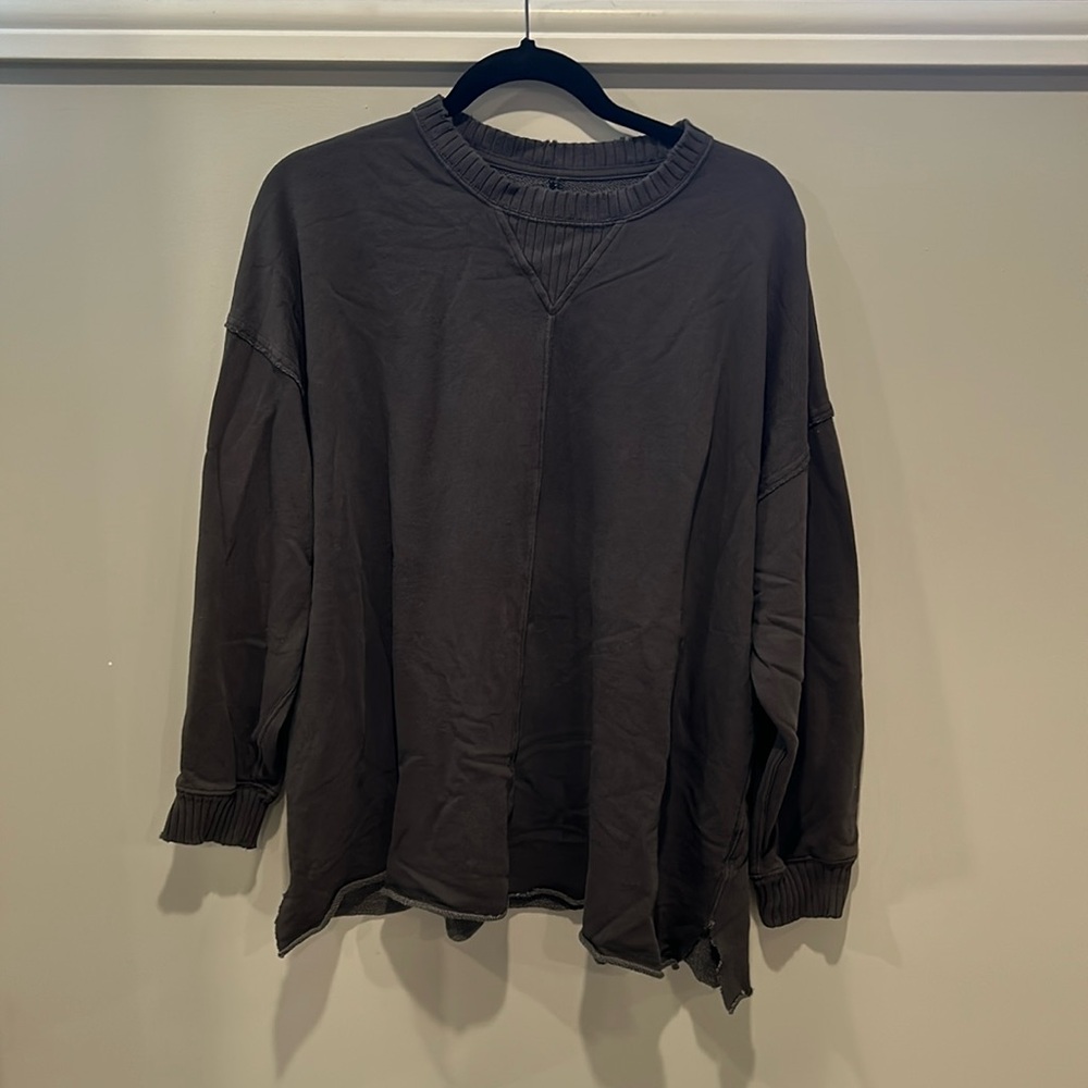 Distressed, oversized sweater
